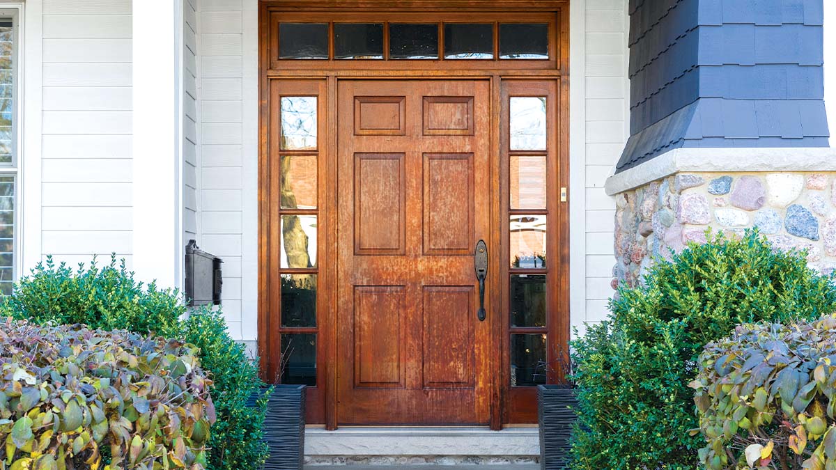 A wooden front door to a home
