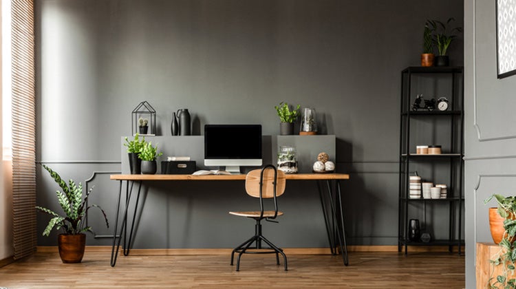 Clean office space with desktop & dark walls