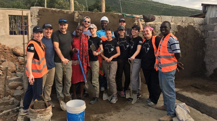 O2E team building a school during Kenya Me to We event