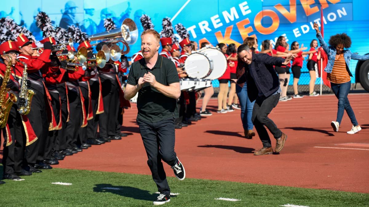 Extreme Makeover: Home Edition host in front of a trumpet band