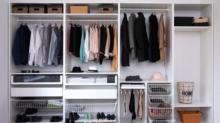 Organized closet with white shelving 