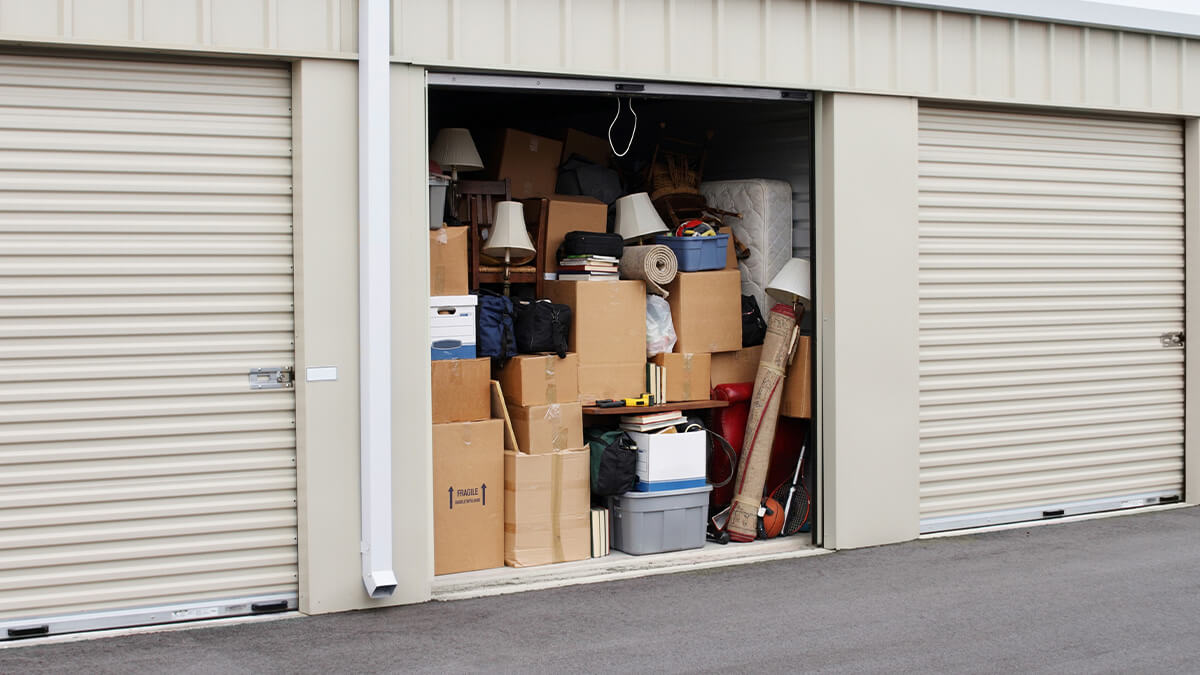 A storage locker packed full with unwanted items.