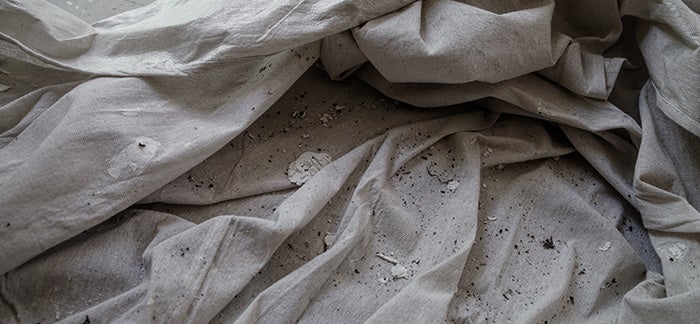 Drop cloths over a bathroom floor to prevent scratches.