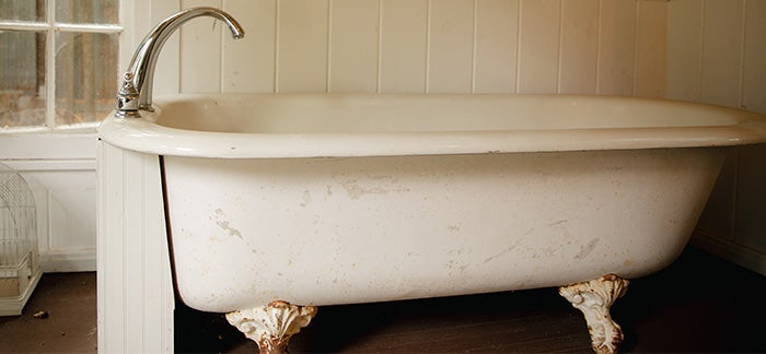 A bathtub that is ready to be removed.