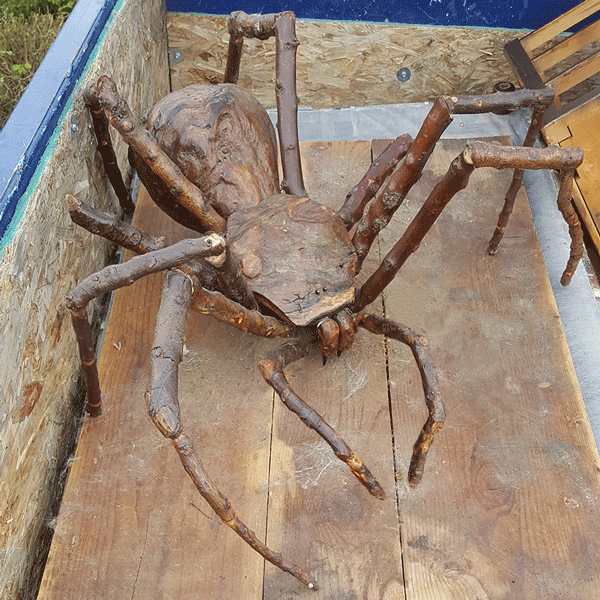 Wooden carved spider on a truck