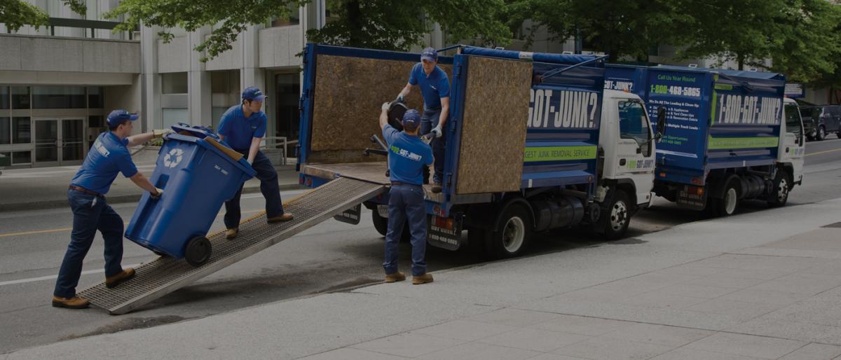 Truck Team Members Loading Junk Into a Truck