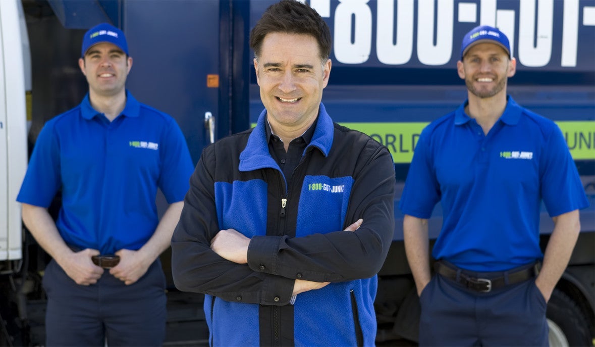 Brian Scudamore in front of 1-800-GOT-JUNK? truck