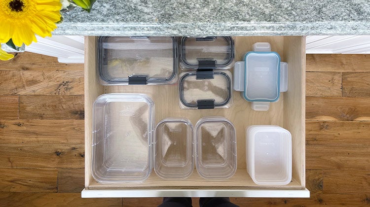 Organized kitchen drawer with tupperware