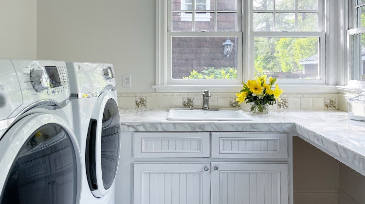 clean laundry room with yellow flowers