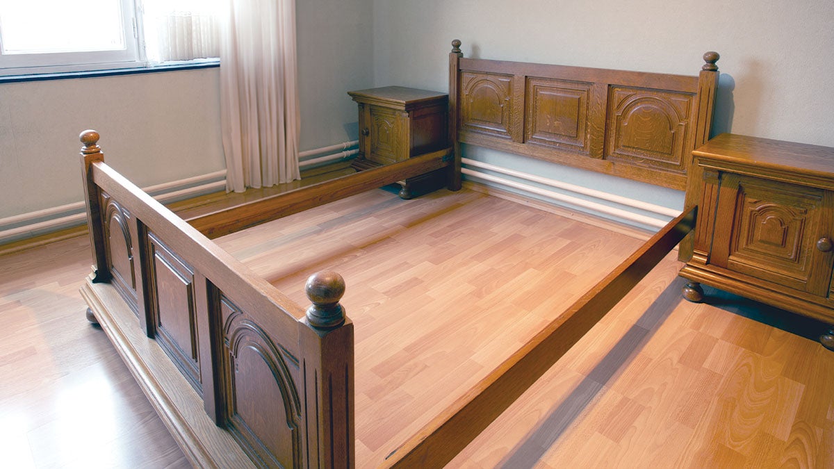 Wooden furniture (bed frame and drawers) ready to be disassembled for moving