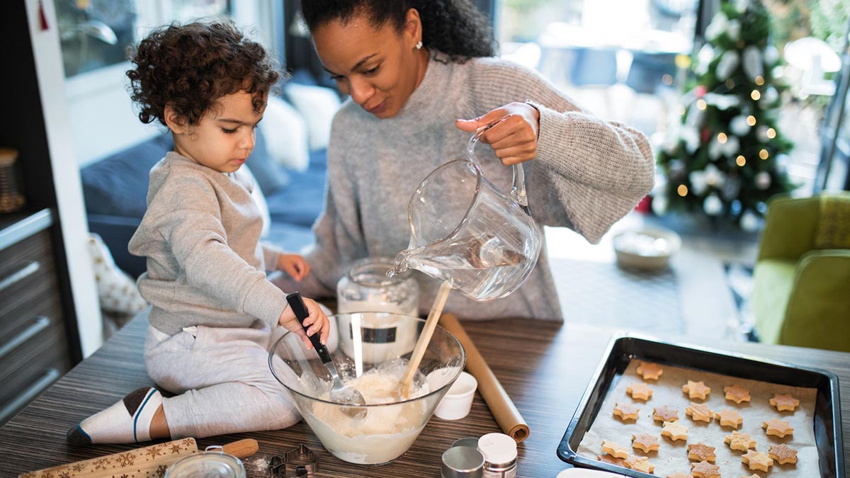 Mother and son baking cookies