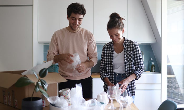 Multiple boxes packed with kitchen items.