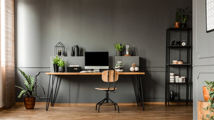 Clean office space with desktop & dark walls Clean office space with desktop & dark walls