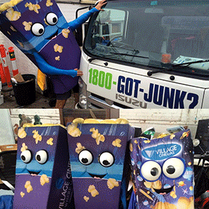Popcorn costumes in front of 1-800-GOT-JUNK? truck