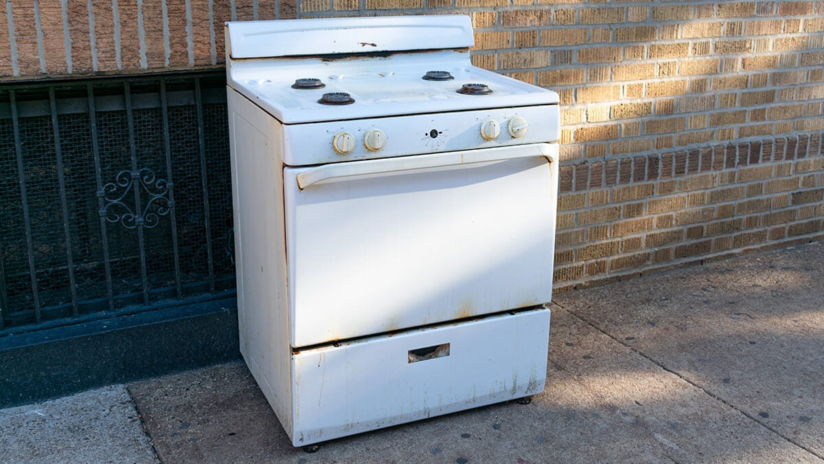 A stove outside a home ready to be disposed.