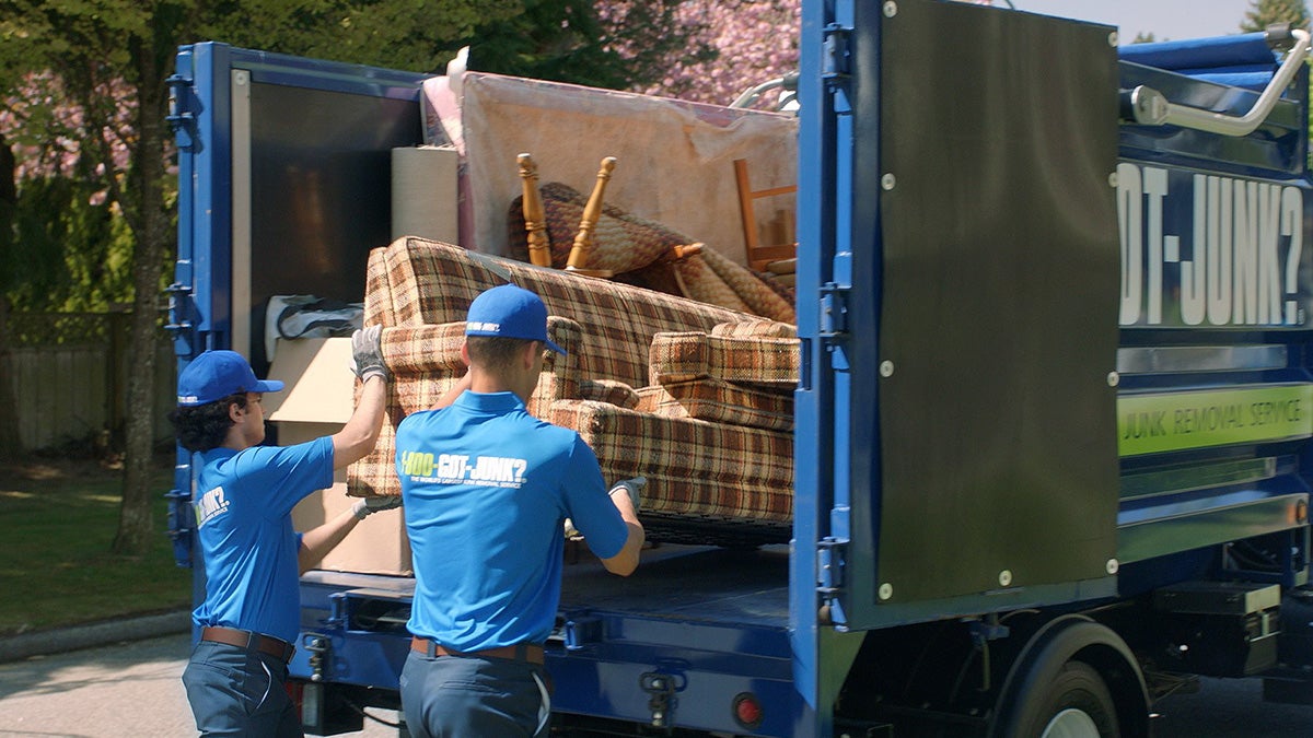 1-800-GOT-JUNK? Team getting rid of a used Couch