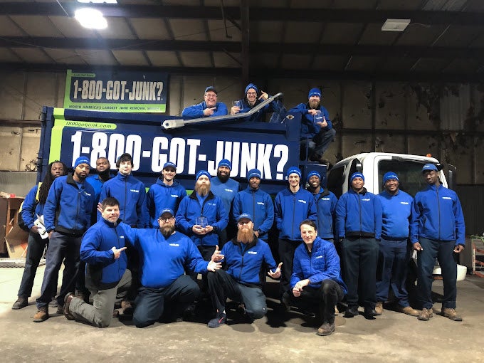 20 1-800-GOT-JUNK? St. Louis team members posing in front of a junk removal truck 20 1-800-GOT-JUNK? St. Louis team members posing in front of a junk removal truck