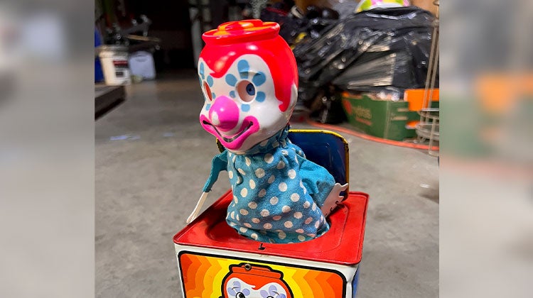 Jack-in-the-box clown with polka dot clothing