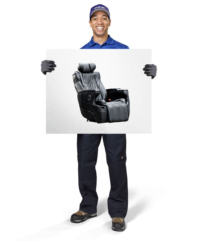 1-800-GOT-JUNK? Truck Team Member holding an image of a massage chair
