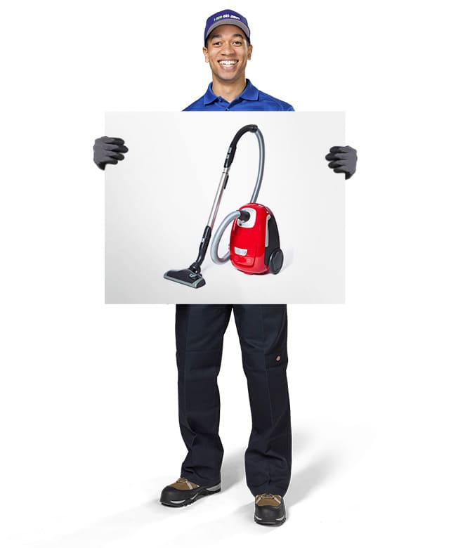 1-800-GOT-JUNK? Truck Team Member holding an image of a vacuum cleaner