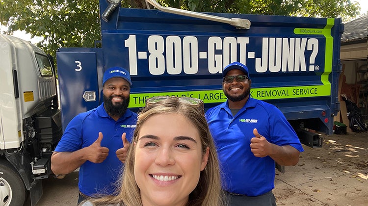 Selfie of Lilly Skjoldahl from The Furniture Dr and two members of the 1-800-GOT-JUNK? team smiling at the camera