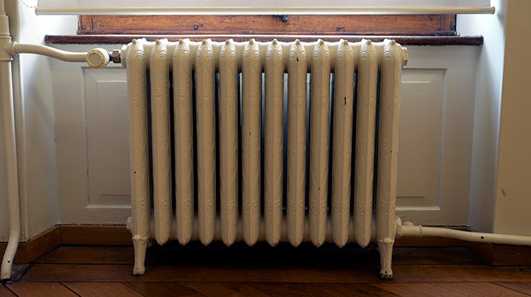 An old cast iron heater scrap ready to be recycled An old cast iron heater scrap ready to be recycled