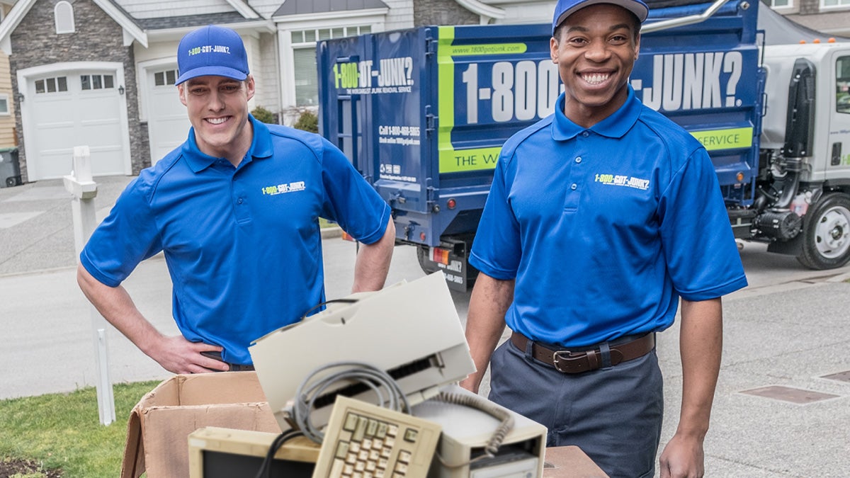 1-800-GOT-JUNK? Truck team disposing of old computers