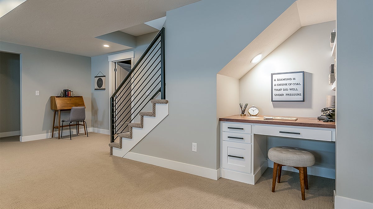 Clean basement with office nook 