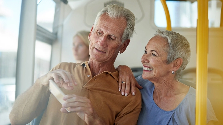 Older couple enjoying public transit ride Older couple enjoying public transit ride