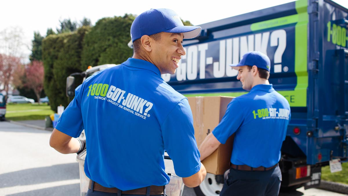 Uniformed TOM walking to 1-800-GOT-JUNK? truck