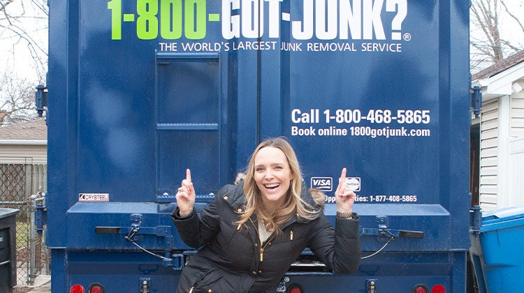 Casey Finn smiling in front of a 1-800-GOT-JUNK? truck Casey Finn smiling in front of a 1-800-GOT-JUNK? truck
