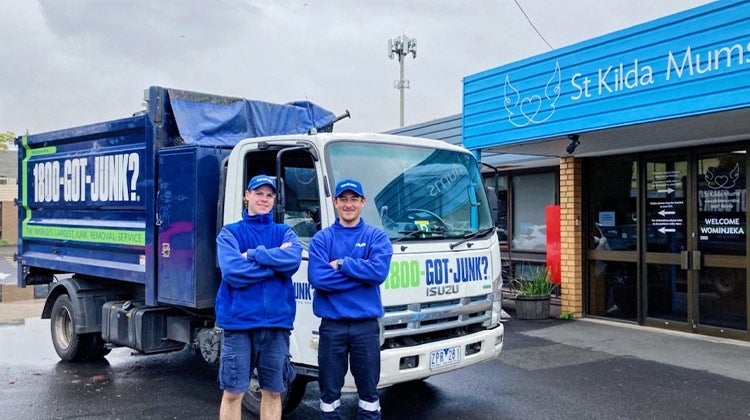 Two 1-800-GOT-JUNK? team members in front of truck