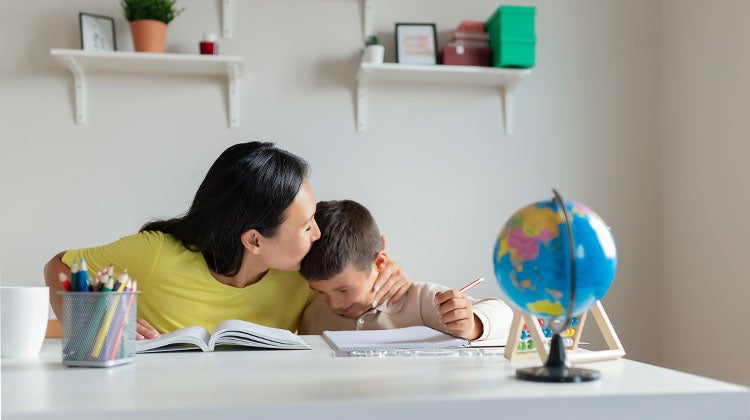 Mother and child studying in a homeschool classroom