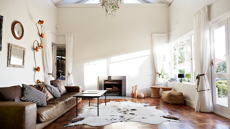 Brightly lit living room with chandelier 