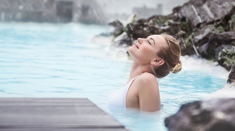 Woman relaxing in a hot tub at a spa 