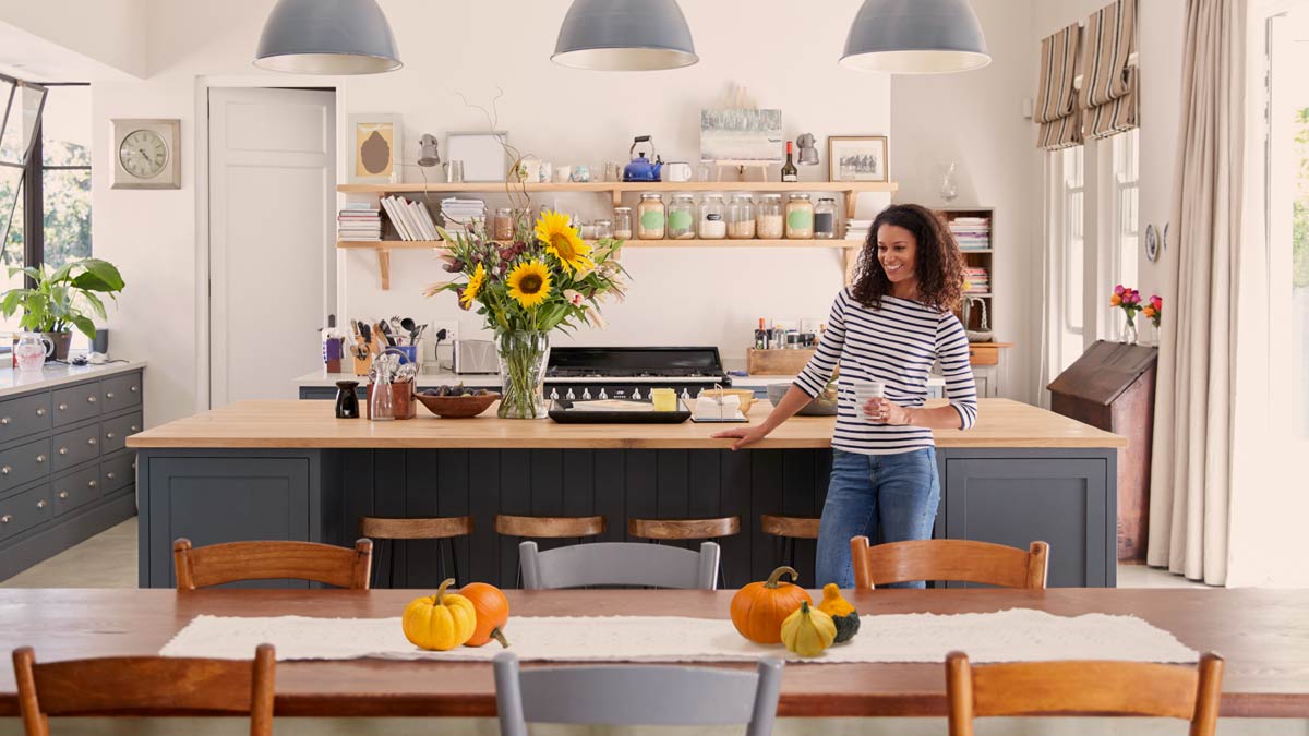 Woman standing in her clean kitchen