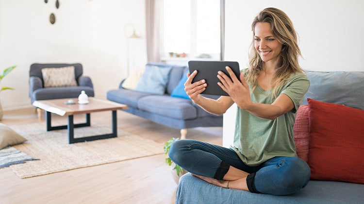 Woman using a tablet to video chat 