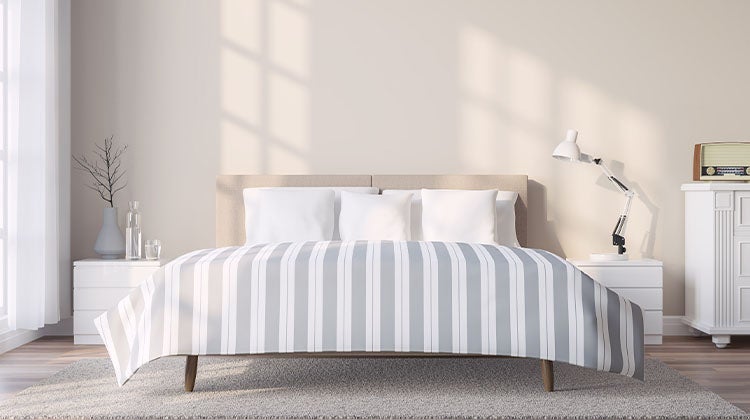 Clean bedroom with a white and blue striped duvet Clean bedroom with a white and blue striped duvet