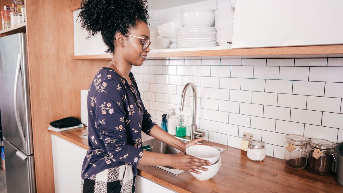 women-organizing-kitchen-dishes