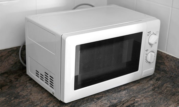 How to dispose of a microwave Old microwave on kitchen counter
