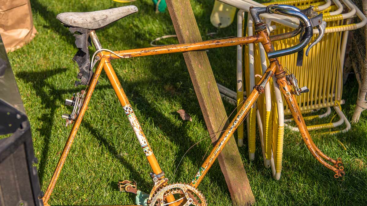 Old broken brown bicycle