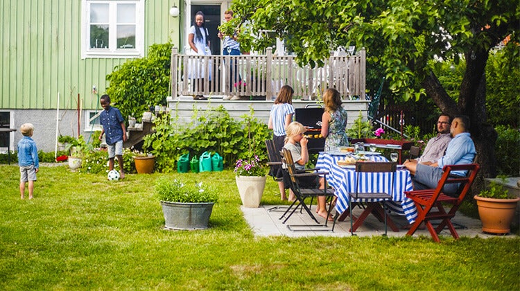 Family and friends enjoying an outdoor barbeque