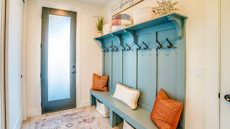 Decluttered front entrance with blue wooden coat rack Decluttered front entrance with blue wooden coat rack