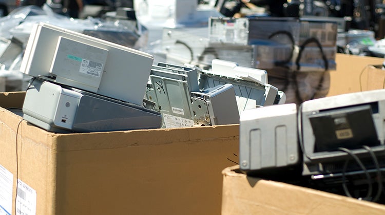 Boxes with old and broken printers for disposal