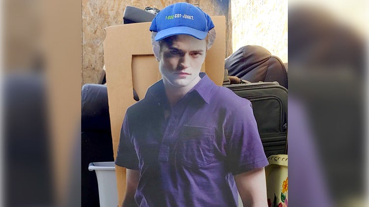 Edward Cullen cardboard cut-out wearing a 1-800-GOT-JUNK? hat