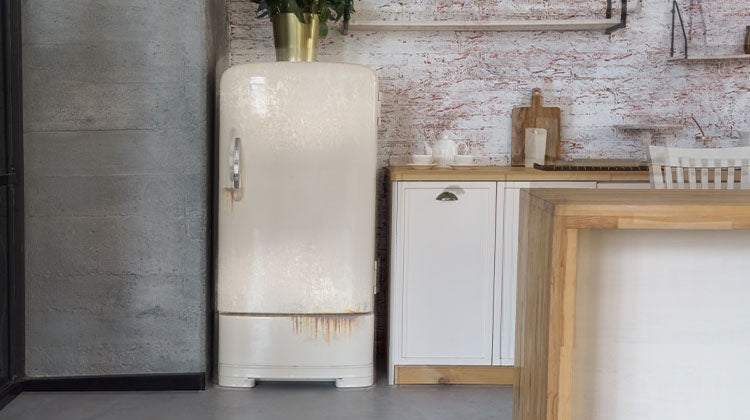 An old refrigerator ready to be disposed of