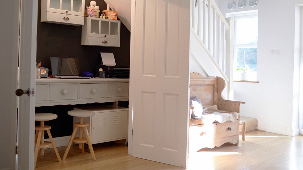 White closet office space with doors