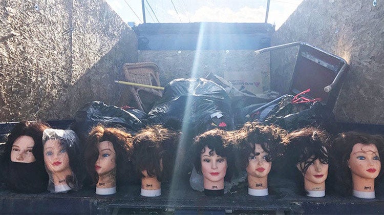 Mannequin heads in a 1-800-GOT-JUNK? truck