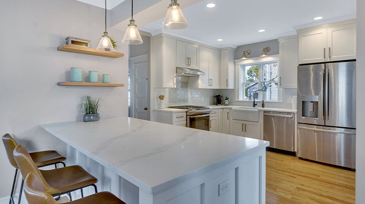 kitchen with white island and cupboards