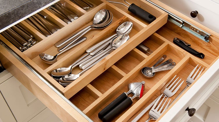 Utensils neatly organized in a drawer Utensils neatly organized in a drawer